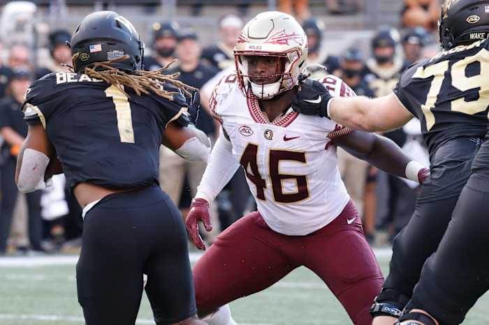 Wake Forest Demon Deacons running back Christian Beal-Smith (1) tries to get past Florida State Seminoles linebacker DJ Lundy (46) during the second half at Truist Field.